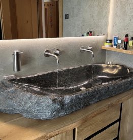 Large natural stone washbasin made from local Passeirer gneiss with characteristic veining, crafted by Gasser Naturstein in Barbian, South Tyrol. | © ©Gasser Naturstein