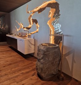 Freestanding natural stone washbasin as a monolithic vanity in the sauna and wellness area, crafted by Gasser Naturstein in Barbian, South Tyrol. | © ©Gasser Naturstein