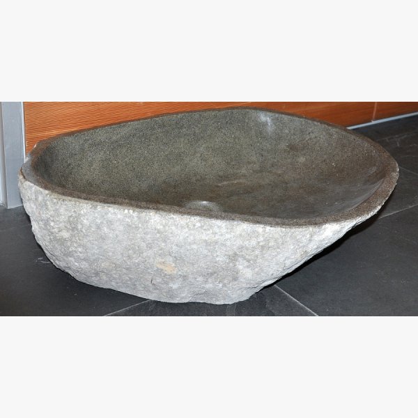 Wash basin made of basalt boulder
