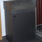 Wash basin made of Nero Assoluto with steel furniture