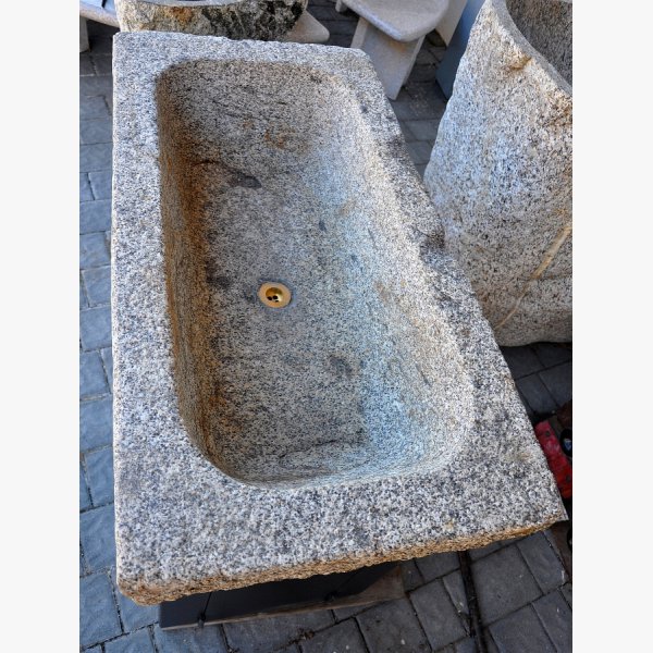 Old, deep feeding trough with steel furniture