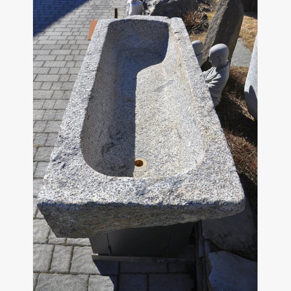 Old, deep feeding trough with steel furniture