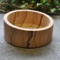Round sandstone washbasin with slant on top