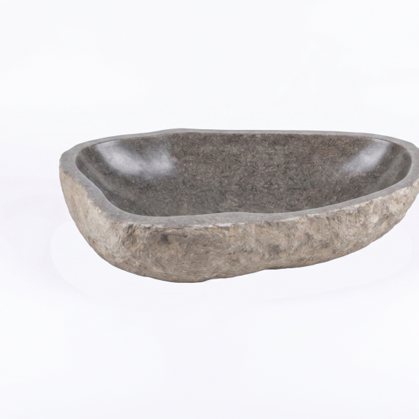 Massives Aufsatzwaschbecken aus grauem Granit-Findling auf einer Waschtischplatte