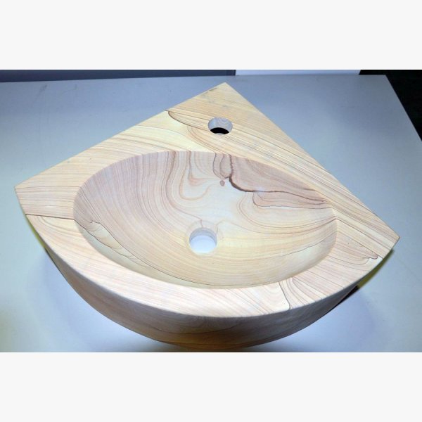 Corner washbasin made of sandstone