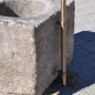 Antiker gräulicher Mörser umgerüstet zu einem Natursteinbrunnen aus Granit mit der Jahreszahl 1844