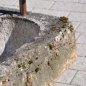 Old feeding trough converted into a natural stone garden fountain