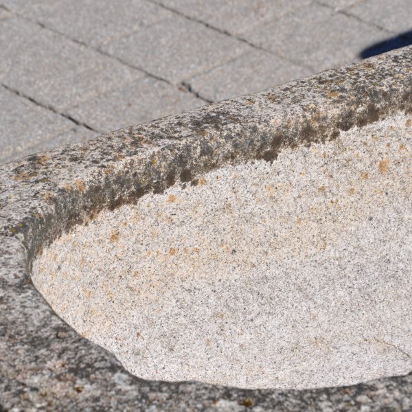 Old feeding trough converted into a natural stone garden fountain
