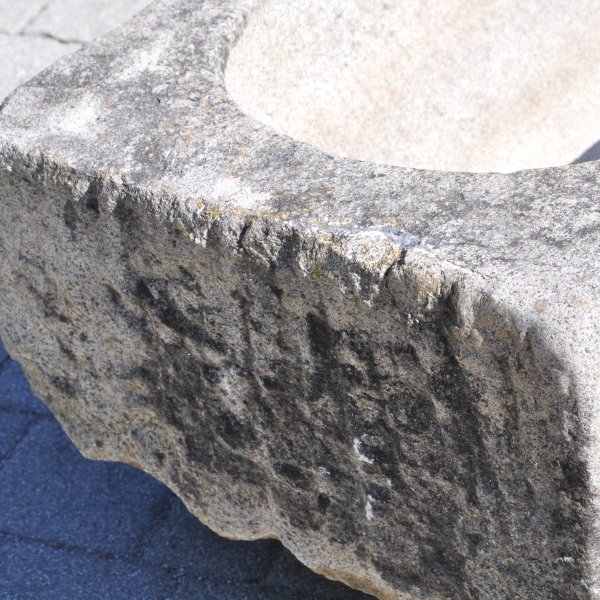 Antique feeding trough converted into a natural stone garden fountain