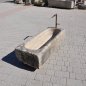 Antique feeding trough converted into a natural stone garden fountain