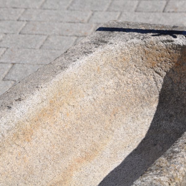Antique feeding trough converted into a natural stone garden fountain