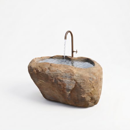 Rustikaler Natursteinbrunnen aus einem echten Findling